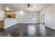 Expansive living space featuring hardwood floors, seamlessly connected to the kitchen and outdoor access at 4608 Snake Eyes St # 102, Las Vegas, NV 89122