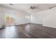 Bright living room featuring sleek hardwood floors and a sliding glass door for natural light at 4608 Snake Eyes St # 102, Las Vegas, NV 89122