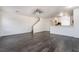 Open-concept living area boasts modern flooring and a half-wall to the kitchen, great for entertaining at 4608 Snake Eyes St # 102, Las Vegas, NV 89122