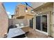Enclosed patio space with outdoor seating, a barbecue, and attractive brick pavers at 4650 Ridgeley Ave # 103, North Las Vegas, NV 89084