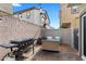 Cozy outdoor patio with comfortable seating and a barbecue grill, perfect for gatherings at 4650 Ridgeley Ave # 103, North Las Vegas, NV 89084