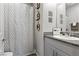 Well-lit bathroom with stylish granite countertop and decorative elements above the toilet at 4650 Ridgeley Ave # 103, North Las Vegas, NV 89084