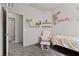 Adorable bedroom with floral decorations, cozy chair, and soft lighting at 4650 Ridgeley Ave # 103, North Las Vegas, NV 89084