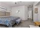 Bright bedroom with carpet, queen size bed and neutral paint throughout at 4650 Ridgeley Ave # 103, North Las Vegas, NV 89084