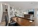 Spacious living area showcasing an open floor plan, kitchen, and staircase with a desk for an office space at 4650 Ridgeley Ave # 103, North Las Vegas, NV 89084