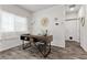 Bright home office featuring a modern desk, large window, and stylish decor, perfect for remote work at 4650 Ridgeley Ave # 103, North Las Vegas, NV 89084