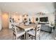 Open floor plan features a dining area and kitchen with stainless appliances and granite countertops at 4720 Flower Moon Ave # 101, North Las Vegas, NV 89084