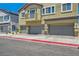 Charming townhome featuring multiple garages and a private balcony offers comfortable, convenient living at 4720 Flower Moon Ave # 101, North Las Vegas, NV 89084