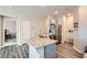 Kitchen with stainless steel appliances, granite countertops, gray cabinets, and wood look flooring at 4720 Flower Moon Ave # 101, North Las Vegas, NV 89084