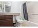 Bathroom with a shower/tub combo, tile surround, toilet and granite vanity at 5114 S Jones Blvd # 202, Las Vegas, NV 89118