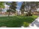 Expansive green lawn area lined with mature trees and well manicured landscaping at 5114 S Jones Blvd # 202, Las Vegas, NV 89118
