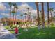 Well-maintained community area with lush landscaping, mature palm trees, and decorative rock features at 5114 S Jones Blvd # 202, Las Vegas, NV 89118