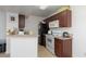 Kitchen features white appliances, granite countertops, and wood cabinets at 5114 S Jones Blvd # 202, Las Vegas, NV 89118
