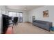 Bright living room features a sliding glass doors and comfortable seating at 5114 S Jones Blvd # 202, Las Vegas, NV 89118