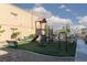 Community playground area featuring a slide, climbing structure, swings, and seating at 5114 S Jones Blvd # 202, Las Vegas, NV 89118