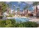 A pristine pool surrounded by tropical landscaping and lounge seating at 5114 S Jones Blvd # 202, Las Vegas, NV 89118