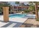 Community pool with palm trees and views of surrounding buildings at 5114 S Jones Blvd # 202, Las Vegas, NV 89118