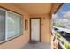 Entrance porch showcasing unit number, exterior light and desert landscaping views at 5114 S Jones Blvd # 202, Las Vegas, NV 89118