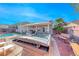 Relax in this backyard oasis with a hot tub, mature desert landscaping, and a covered patio at 52 Vallejo Verde St, Henderson, NV 89012