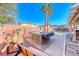 Enjoy the hot tub in this backyard oasis with custom patio, seating, and mature landscaping at 52 Vallejo Verde St, Henderson, NV 89012