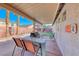 Inviting backyard with an outdoor kitchen, pool, and lush landscaping at 52 Vallejo Verde St, Henderson, NV 89012