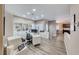 Well-lit home office featuring custom built-ins, modern decor, and stylish wood flooring at 52 Vallejo Verde St, Henderson, NV 89012