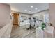 Spacious home office featuring custom shelving, wood floors, and bright natural light at 52 Vallejo Verde St, Henderson, NV 89012