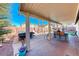 Spacious covered patio with BBQ, seating, and outdoor dining area at 52 Vallejo Verde St, Henderson, NV 89012