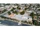 Aerial view showing the house with a large concrete parking area, a carport, and the surrounding neighborhood at 5202 Willis St, North Las Vegas, NV 89031