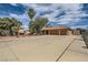 Single-story home with a two-car garage and a long driveway at 5202 Willis St, North Las Vegas, NV 89031