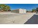 Large detached garage featuring a metal exterior and two roll-up doors at 5202 Willis St, North Las Vegas, NV 89031