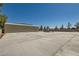 Large detached garage featuring a metal exterior and a large area for parking at 5202 Willis St, North Las Vegas, NV 89031