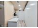 Pantry features white cabinets for storage, a refrigerator, and a microwave at 5202 Willis St, North Las Vegas, NV 89031