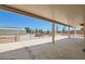 Covered patio with a view of the backyard fence, and workshop at 5202 Willis St, North Las Vegas, NV 89031