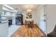Dining area next to the kitchen with a modern table set and hardwood floors at 5576 W Rochelle Ave # 27C, Las Vegas, NV 89103