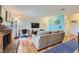 Living room features a fireplace, sofa, and blue accent wall at 5576 W Rochelle Ave # 27C, Las Vegas, NV 89103