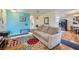 Open-concept living room with access to the kitchen and dining area at 5576 W Rochelle Ave # 27C, Las Vegas, NV 89103