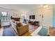 Inviting living room with a brick fireplace, hardwood floors, and comfortable seating at 5576 W Rochelle Ave # 27C, Las Vegas, NV 89103