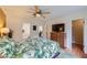 Relaxing main bedroom featuring a TV and ensuite bathroom at 5576 W Rochelle Ave # 27C, Las Vegas, NV 89103