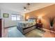 Bedroom featuring a ceiling fan, carpet and a queen sized bed at 5576 W Rochelle Ave # 27C, Las Vegas, NV 89103
