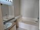 Relaxing bathroom featuring a garden tub and granite vanity at 5655 E Sahara Ave # 2020, Las Vegas, NV 89142