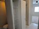 Bathroom storage cabinet with adjustable shelves and tiled floor at 5655 E Sahara Ave # 2020, Las Vegas, NV 89142