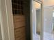 Bedroom closet with built-in drawers and shelving, providing ample storage space at 5655 E Sahara Ave # 2020, Las Vegas, NV 89142