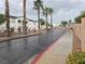 Gated entrance with palm trees and building exteriors at 5655 E Sahara Ave # 2020, Las Vegas, NV 89142