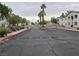Gated entrance with palm trees and well-maintained landscaping at 5655 E Sahara Ave # 2020, Las Vegas, NV 89142