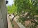 Exterior of the home showing a tree and walkway. The community is well-maintained at 5655 E Sahara Ave # 2020, Las Vegas, NV 89142