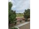 Exterior view showcases lush landscaping, mature trees, and expansive green area at 5655 E Sahara Ave # 2020, Las Vegas, NV 89142