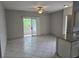 Open living room with sliding glass door to balcony and tile flooring at 5655 E Sahara Ave # 2020, Las Vegas, NV 89142