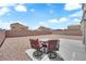 Backyard patio seating with table and chairs for outdoor enjoyment at 5960 Addy Ln, North Las Vegas, NV 89081