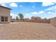 Expansive backyard with gravel, showcasing a patio seating area at 5960 Addy Ln, North Las Vegas, NV 89081